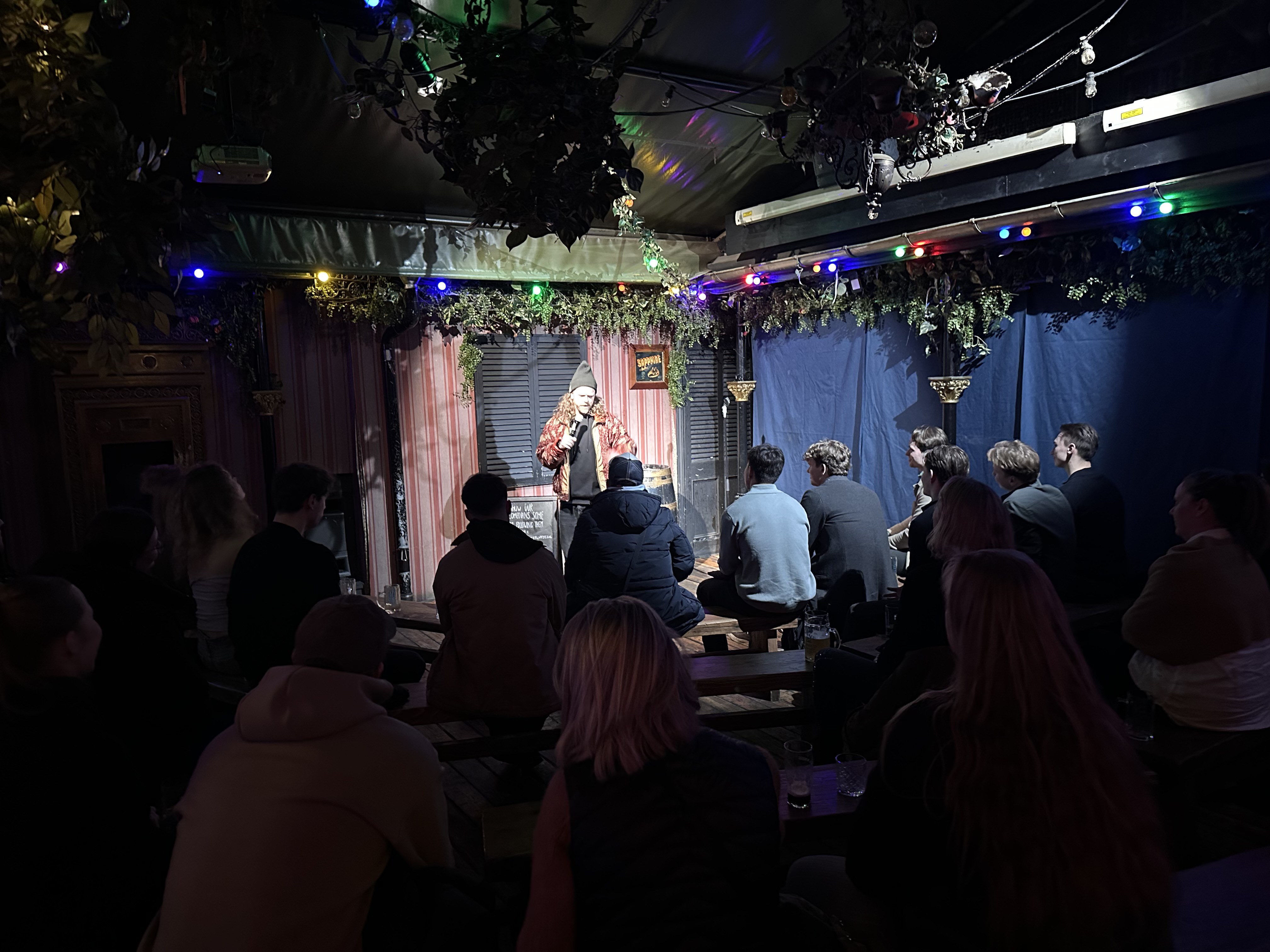 Crowd watching comedy at Proud Mary