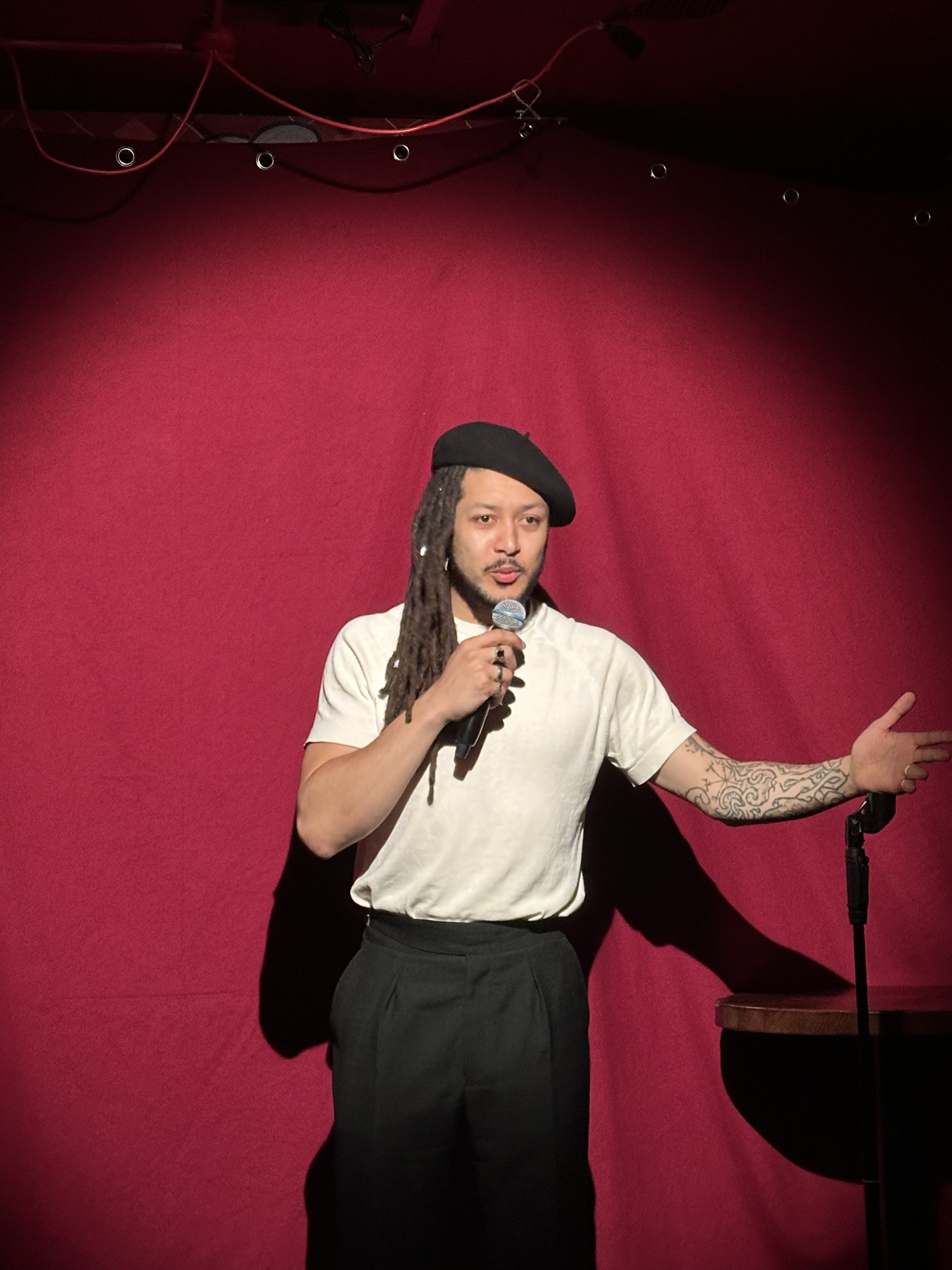 Comedian on stage at No Stress
