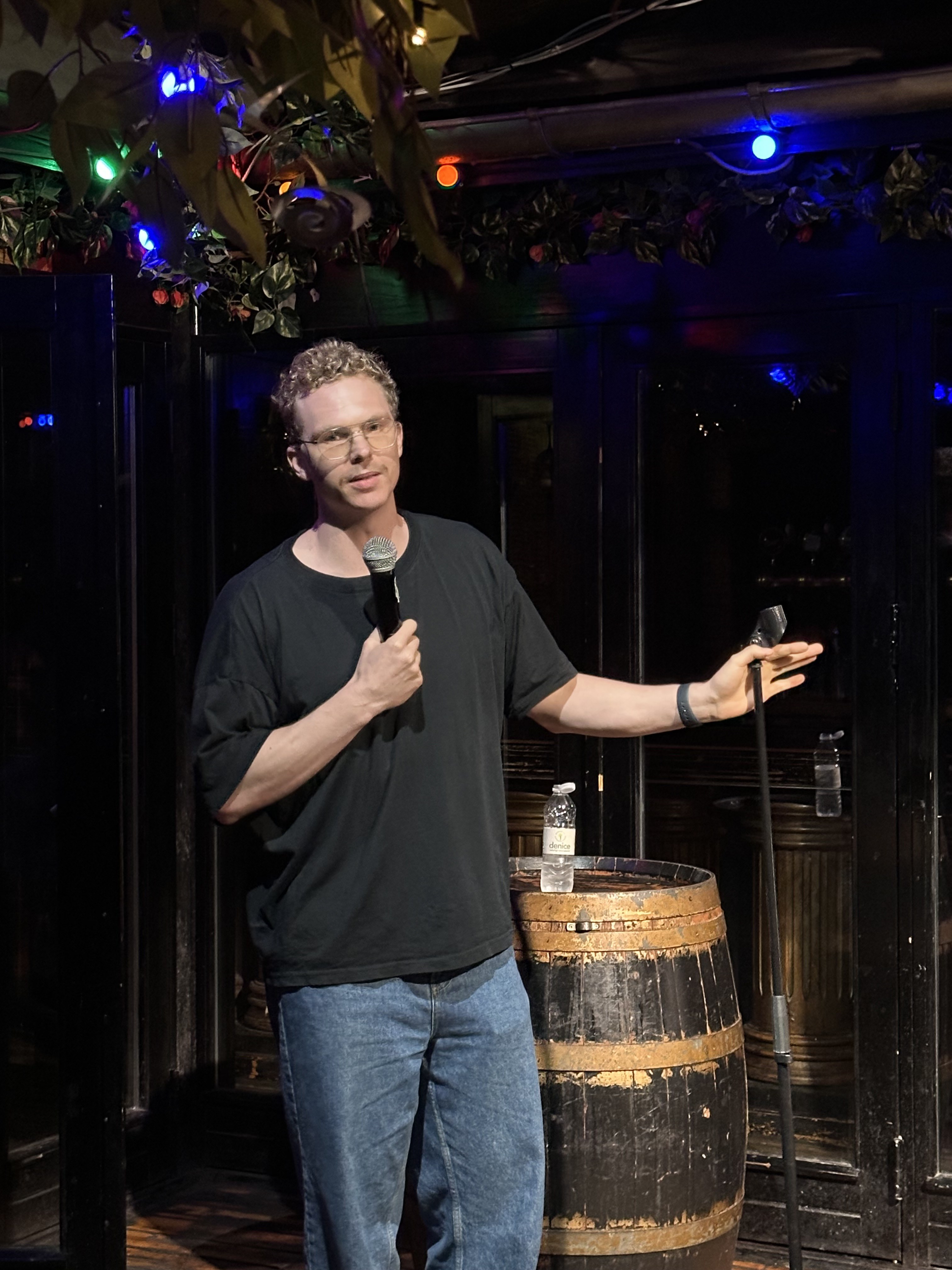 Comedian on stage at Proud Mary