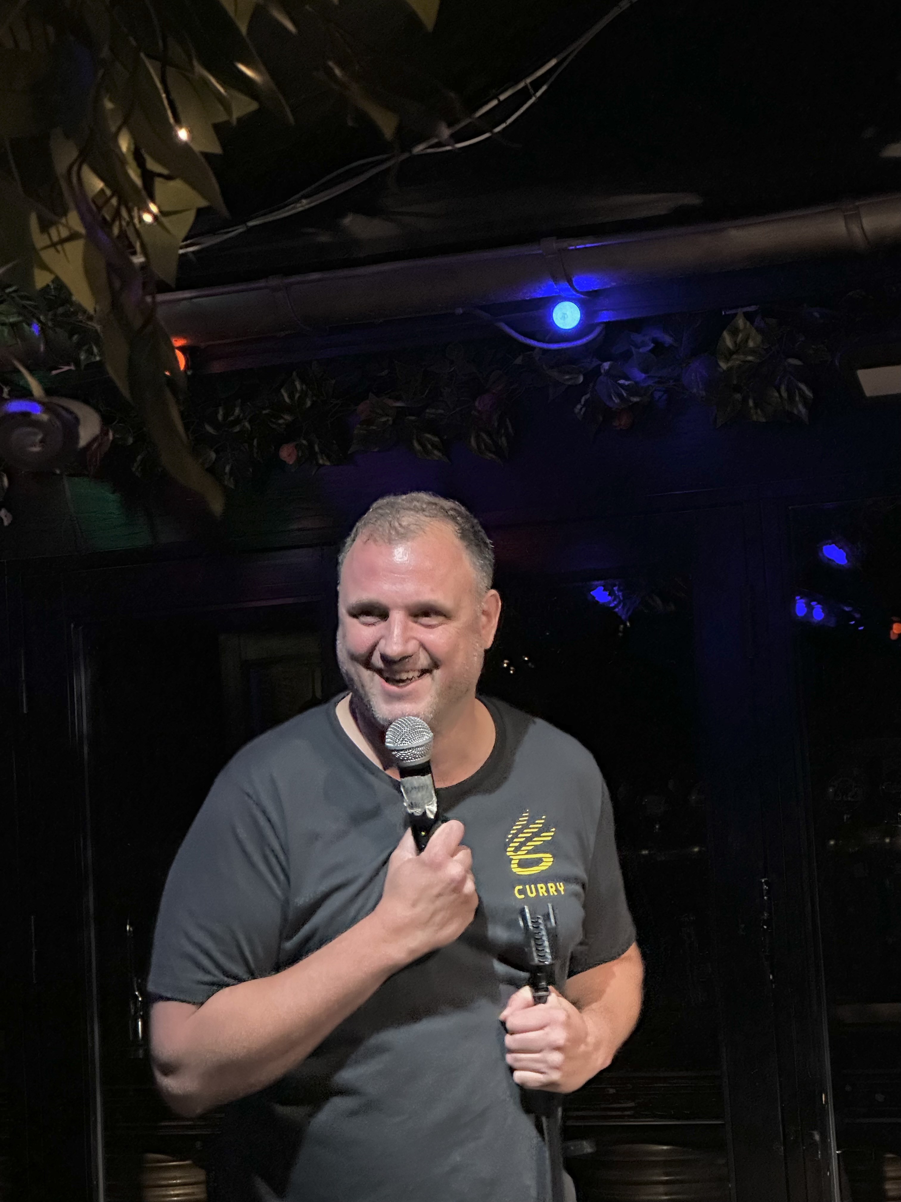 Comedian on stage at Proud Mary