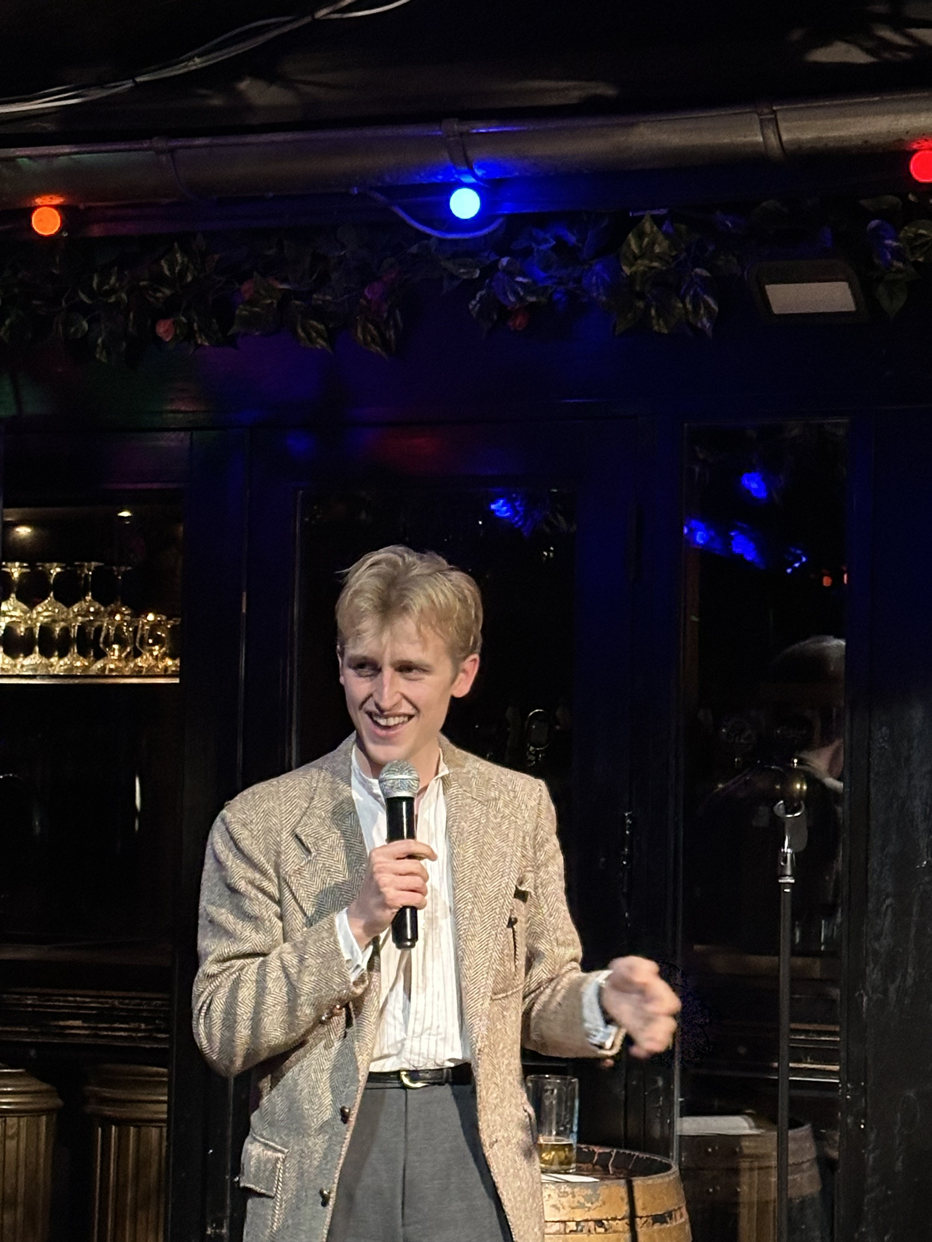 Comedian on stage at Proud Mary